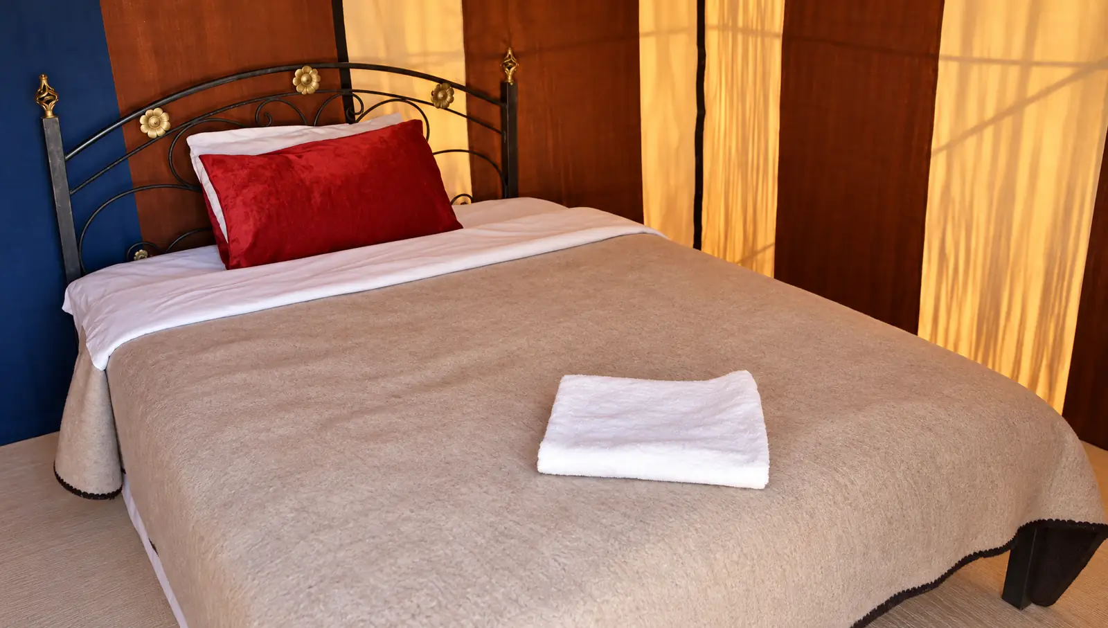 A standard tent with a double bed at Merzouga Standard Tents