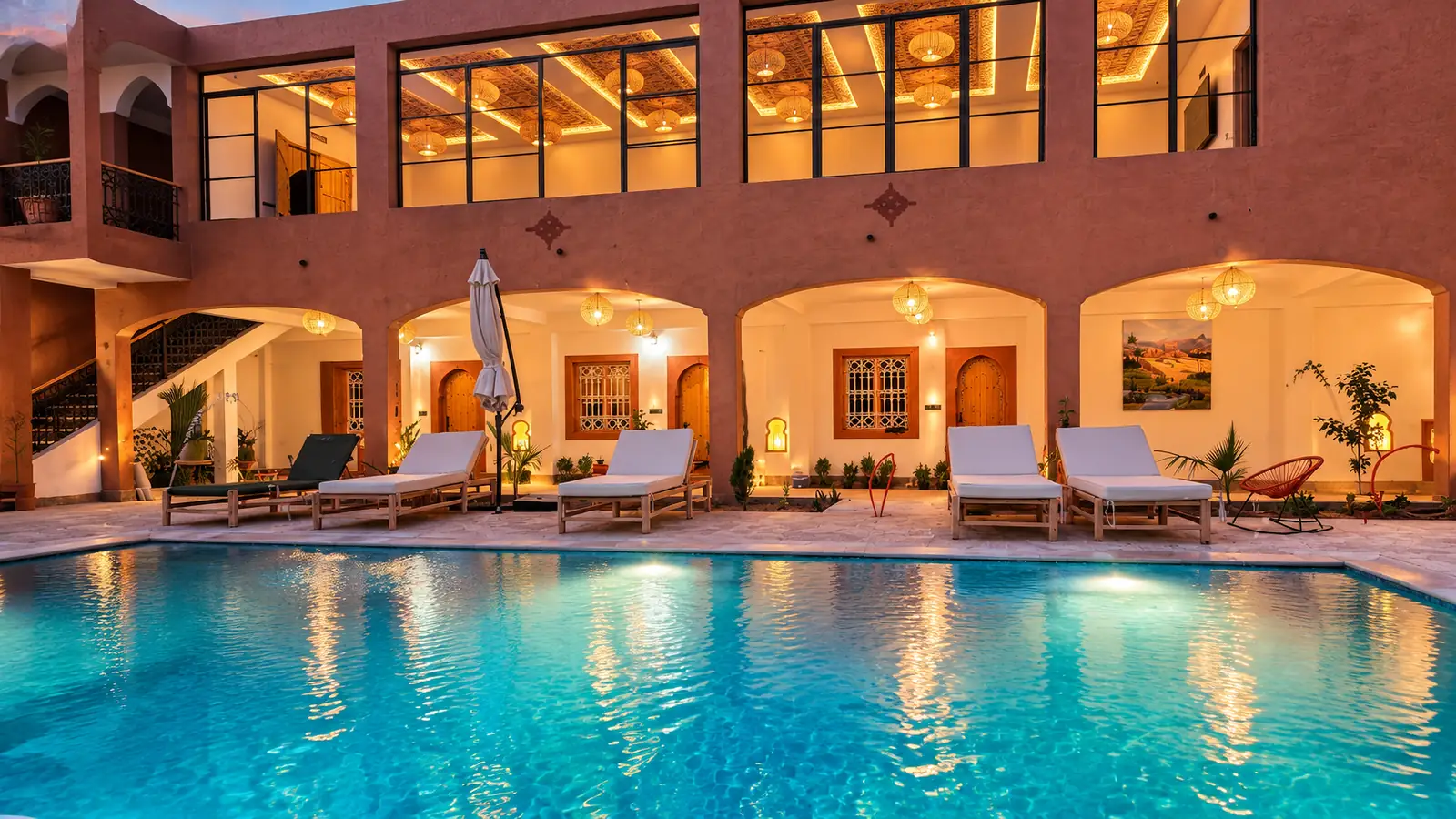 The pool and arches of Rose Garden Dades in the evening